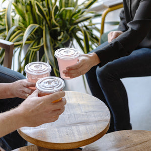 people having drinks in the breakroom using clear cellulosic compostable straws