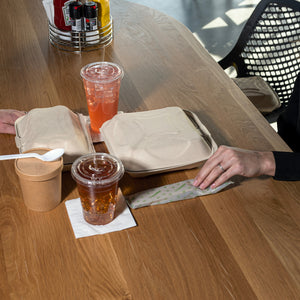 people having drinks in a restaurant using clear cellulosic compostable straws